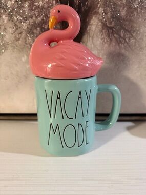 Rae Dunn "Vacay Mode" mug,light blue w/ pink flamingo-shaped topper.